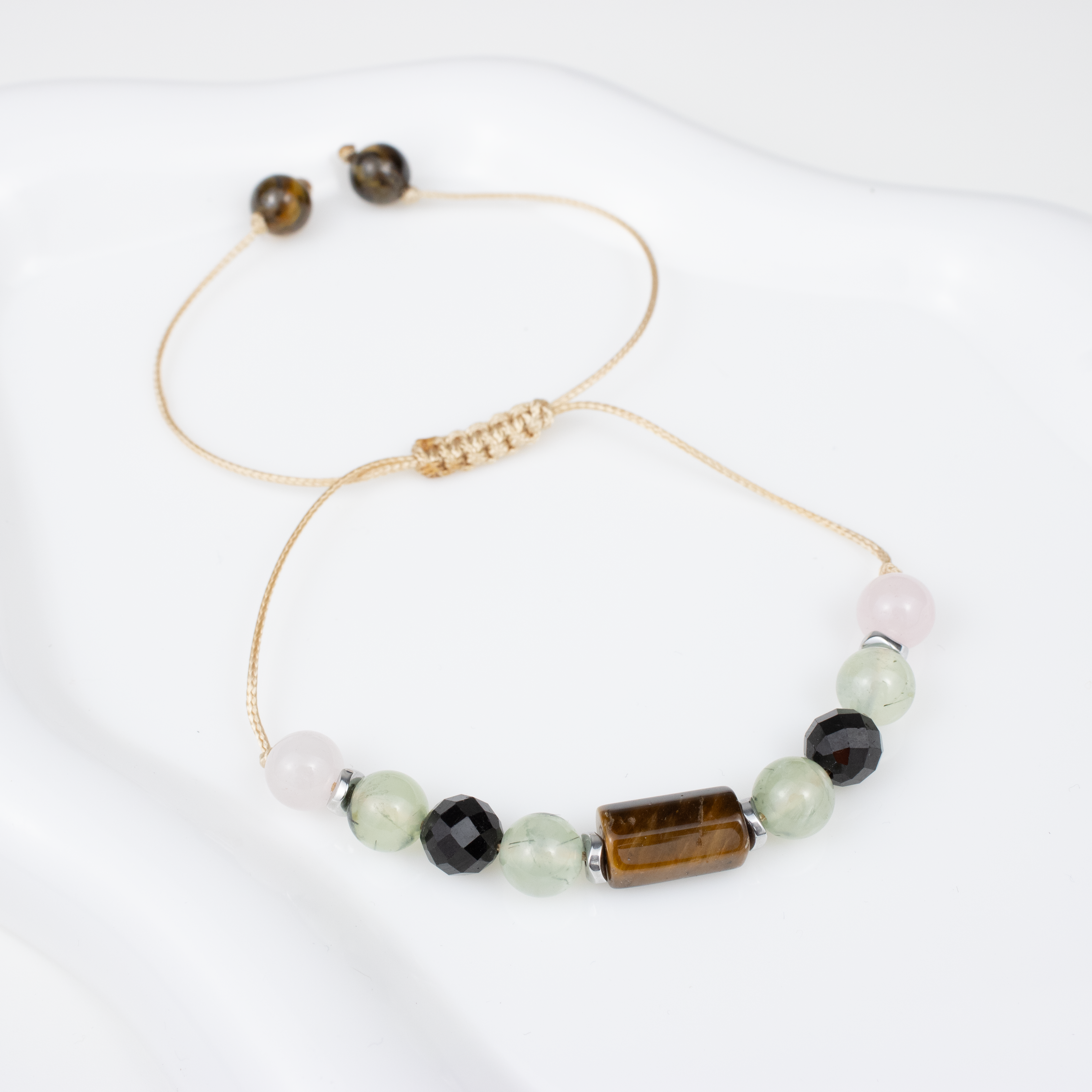 For twos (2, 11, 20, 29): Tourmaline, Rose Quartz, Tiger’s Eye, Prehnite bracelet on a cord