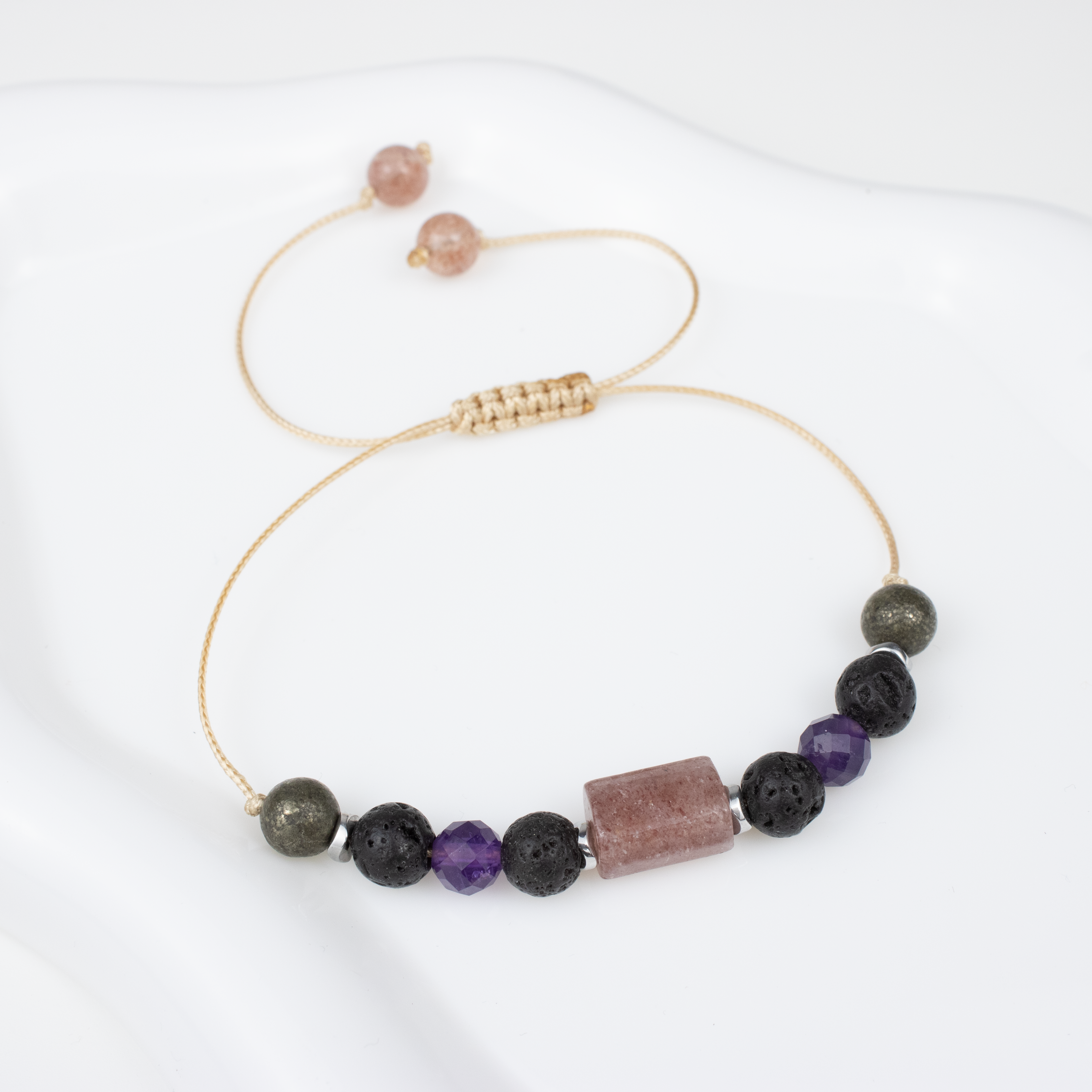 For fours (4, 13, 22, 31): Pyrite, Lava Stone, Amethyst, Strawberry Quartz bracelet on a cord
