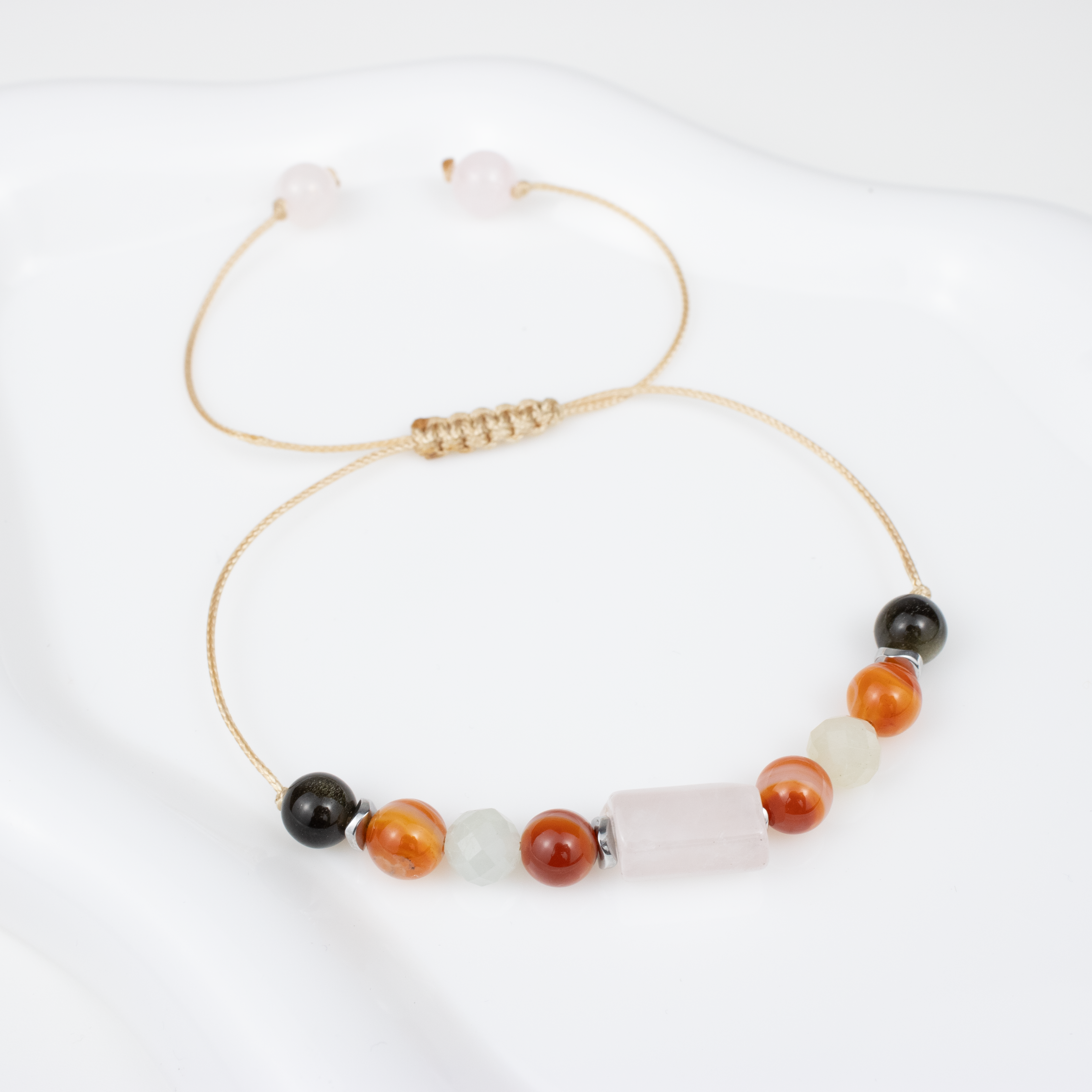 For sixes (6, 15, 24): Obsidian, Carnelian, Morganite, Rose Quartz bracelet on a cord