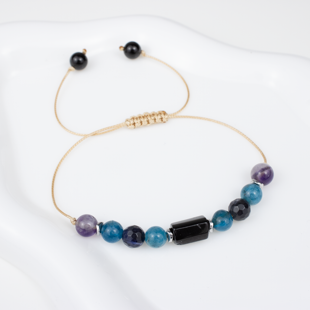 For sevens (7, 16, 25): Tourmaline, Amethyst, Apatite, Lapis Lazuli bracelet on a cord