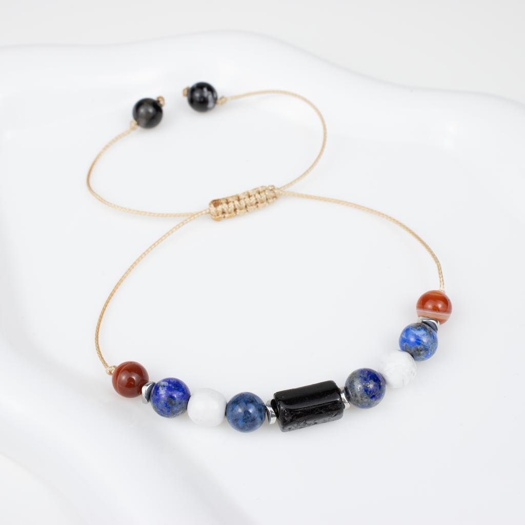 For nines (9, 18, 27): Carnelian, Lapis Lazuli, Howlite, Tourmaline bracelet on a cord