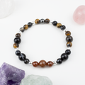 Bracelet made of natural Garnet, Agate, and Tiger’s Eye stones on elastic thread