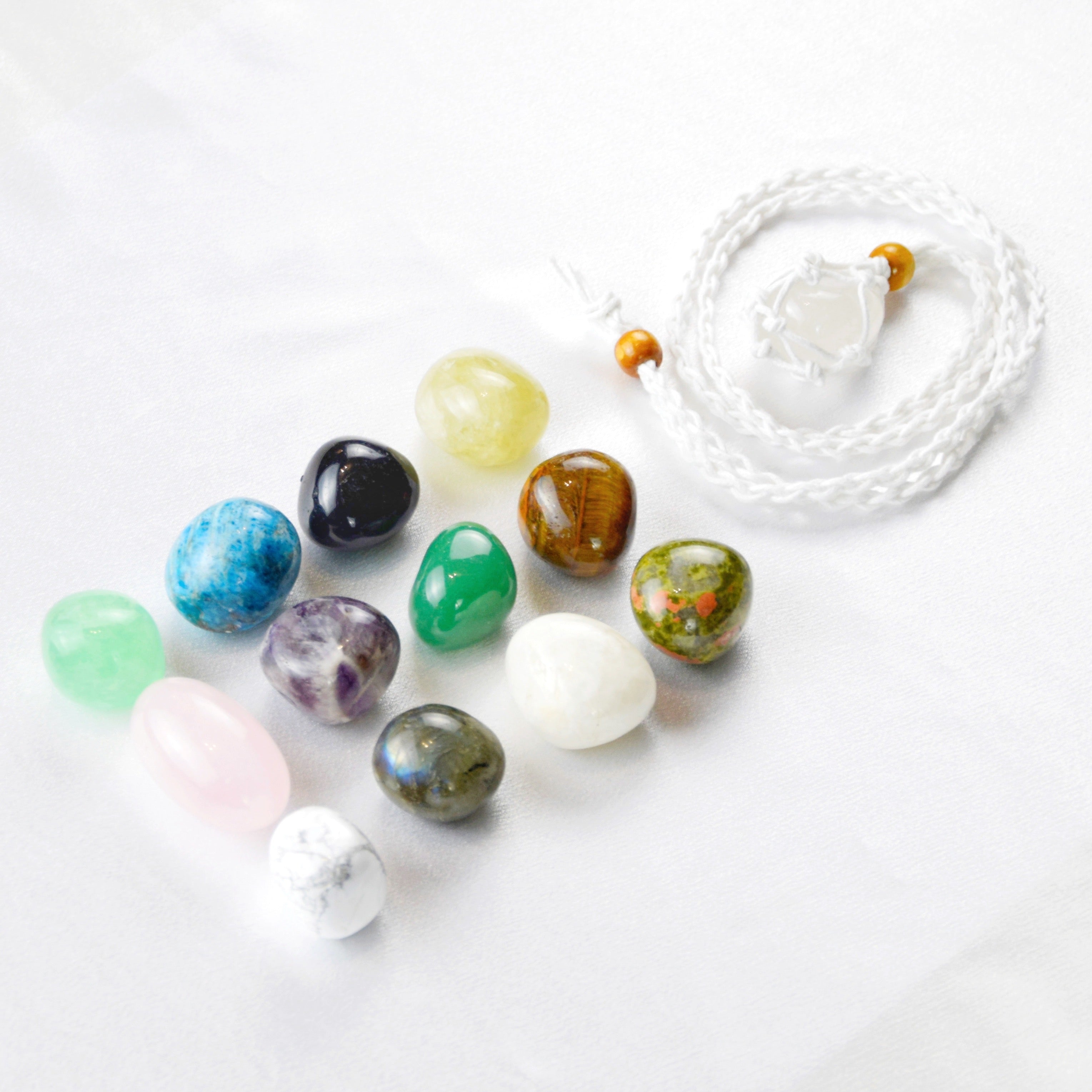 Natural Clear Quartz stone on an adjustable white cord