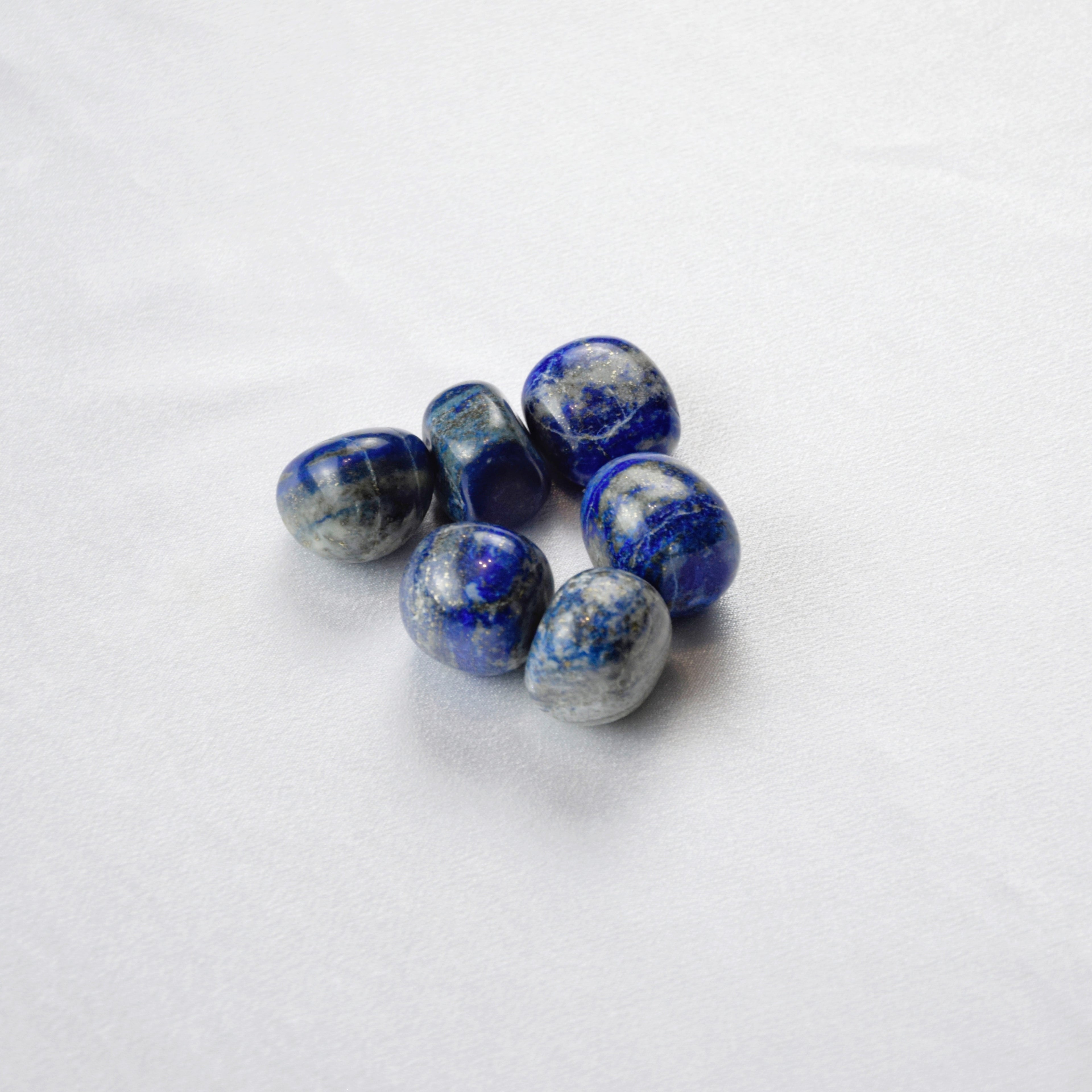 Natural Lapis Lazuli stone on an adjustable white cord
