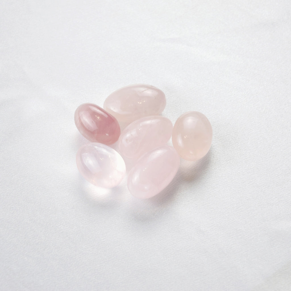Natural Rose Quartz stone on an adjustable white cord