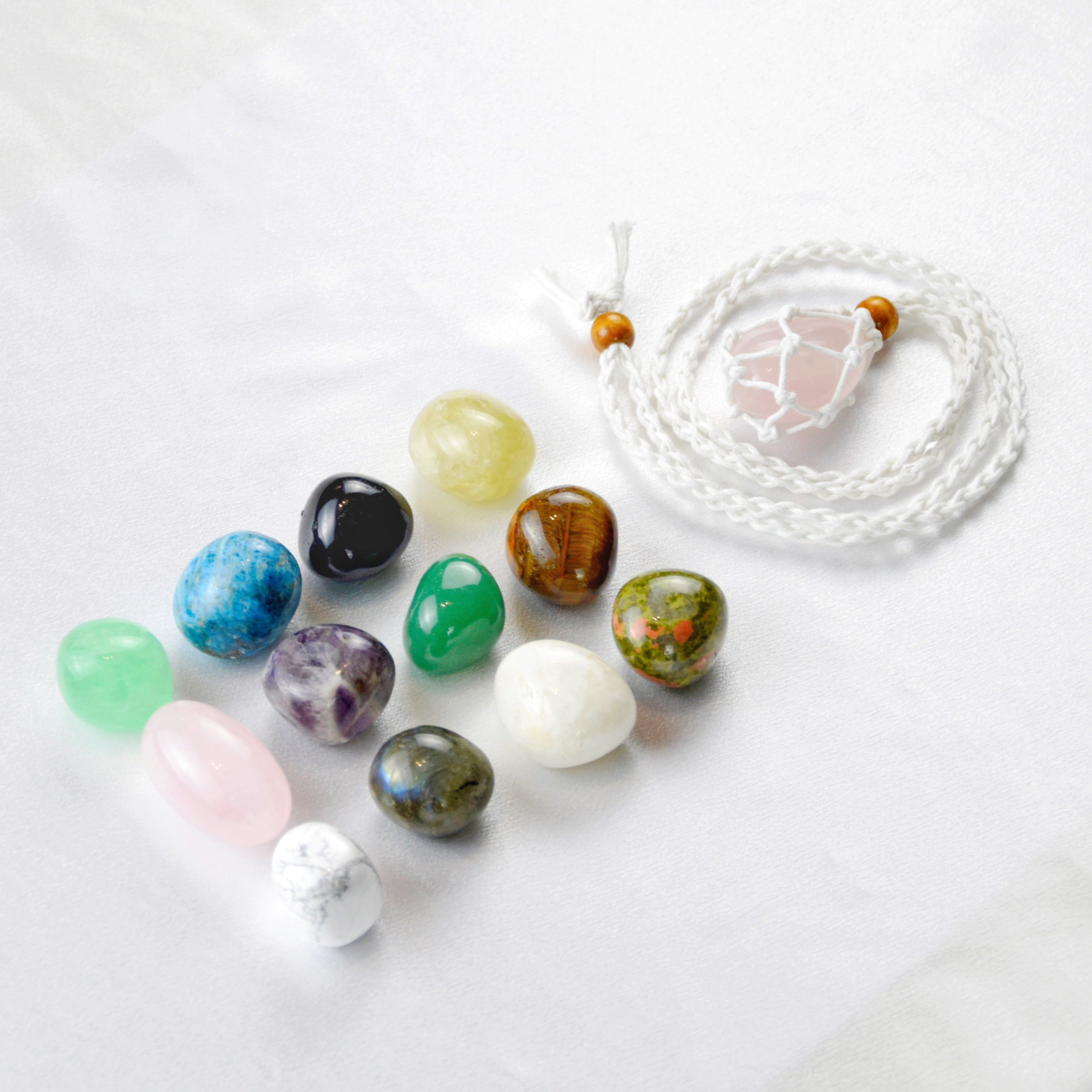 Natural Rose Quartz stone on an adjustable white cord