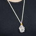 Natural Rose Quartz stone on an adjustable white cord