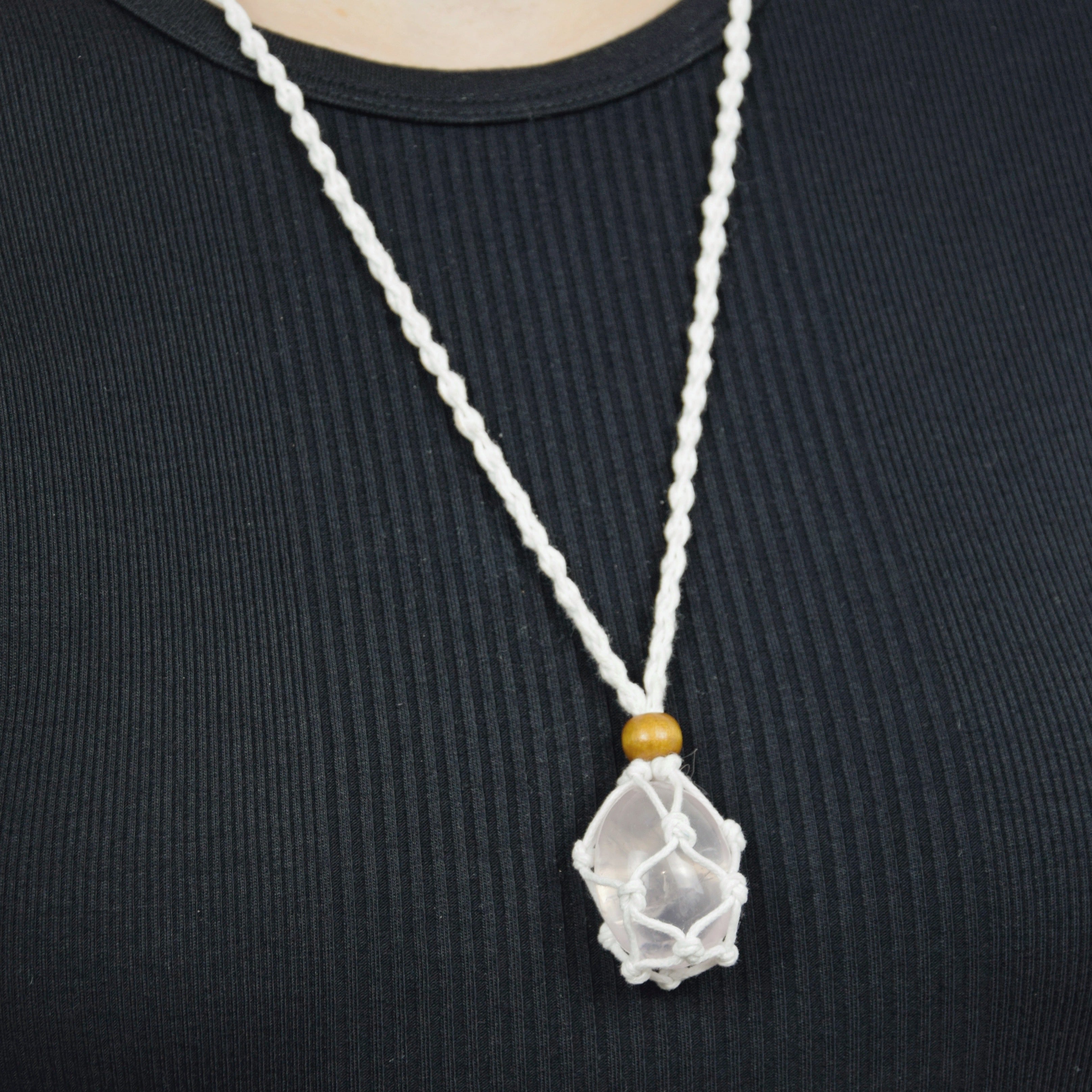 Natural Rose Quartz stone on an adjustable white cord