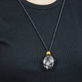 Natural Rose Quartz stone on an adjustable black cord