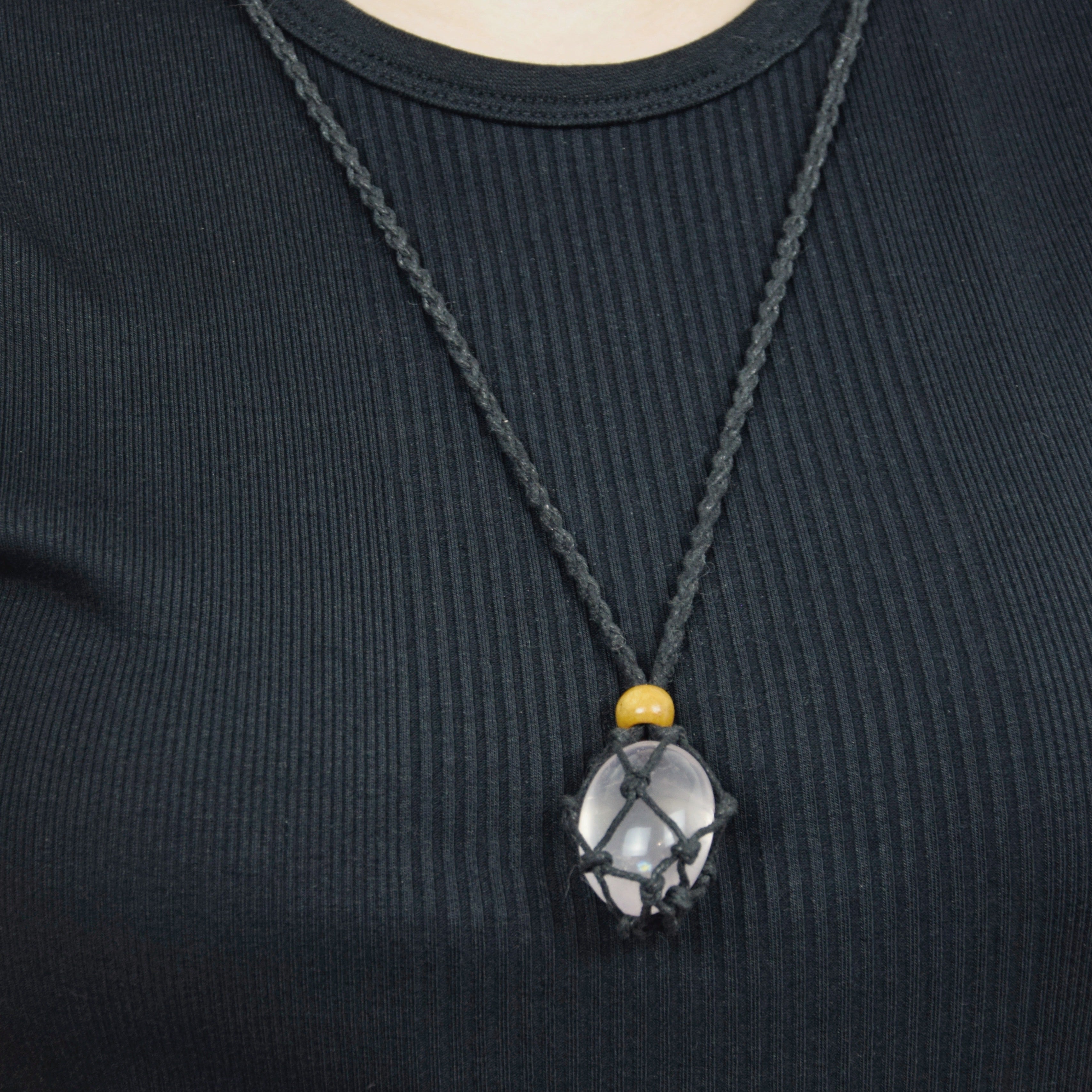 Natural Rose Quartz stone on an adjustable black cord