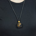 Natural Tiger’s Eye stone on an adjustable black cord