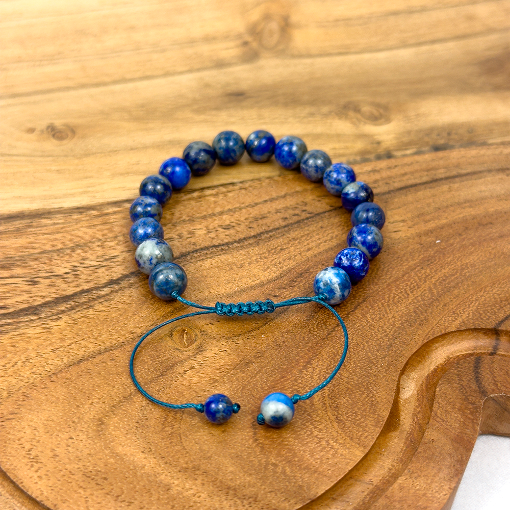Blue beaded bracelet on a wooden surface