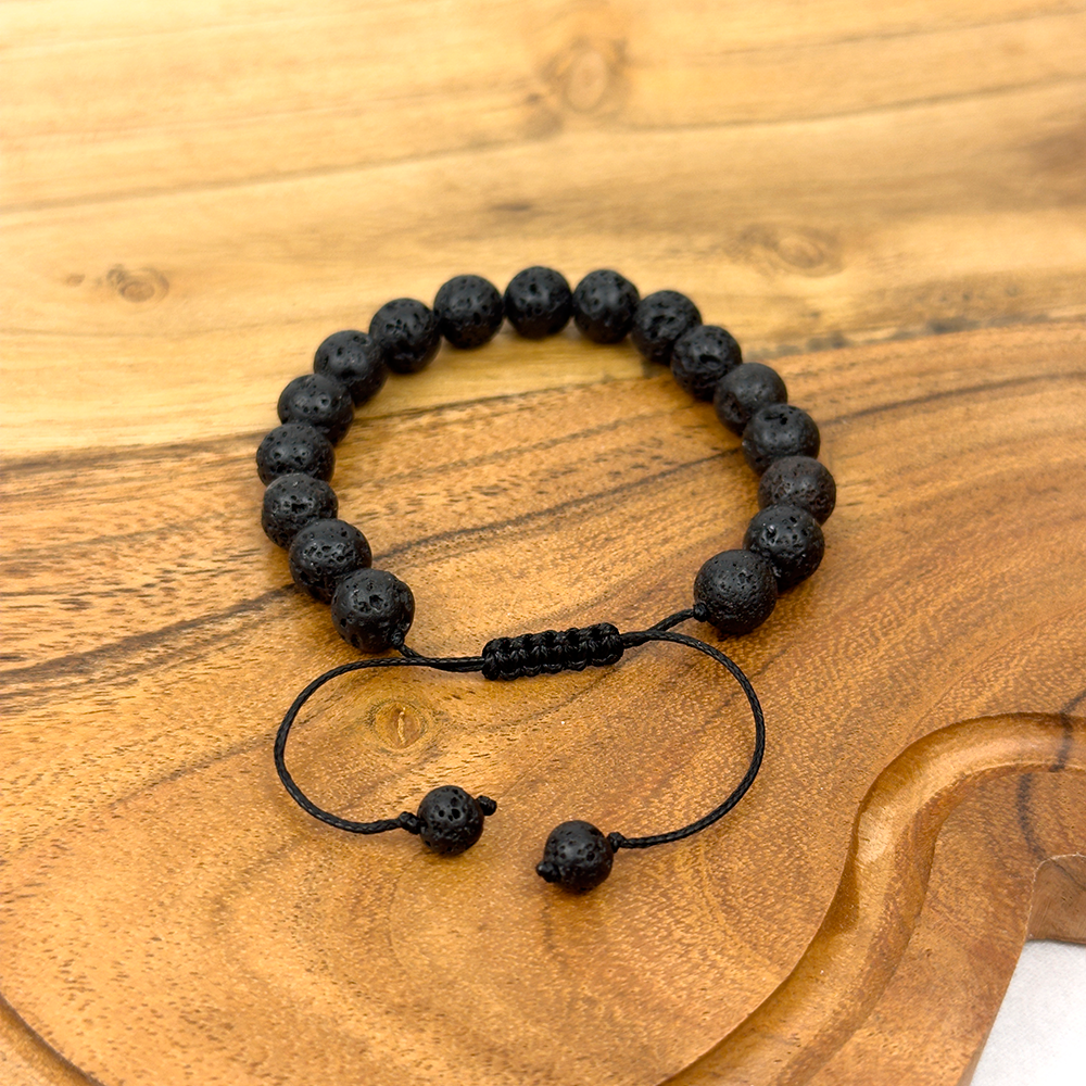Black beaded bracelet on a wooden surface