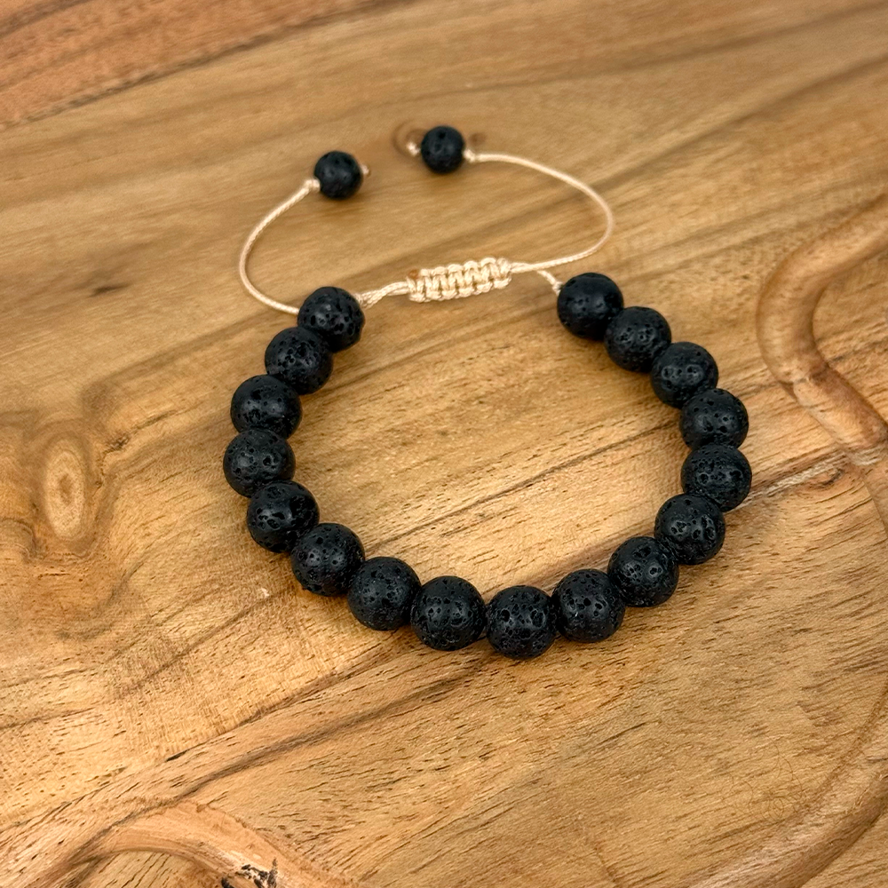 Black beaded bracelet on a wooden surface