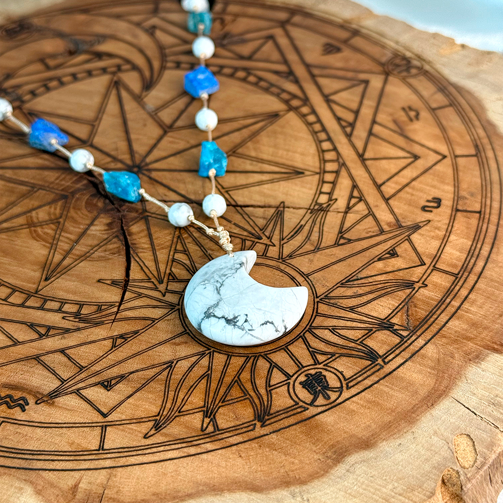 Woven Necklace with a Moon made of natural Howlite, Lapis Lazuli, and Apatite
