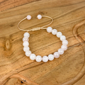 Pearl bracelet on a wooden surface
