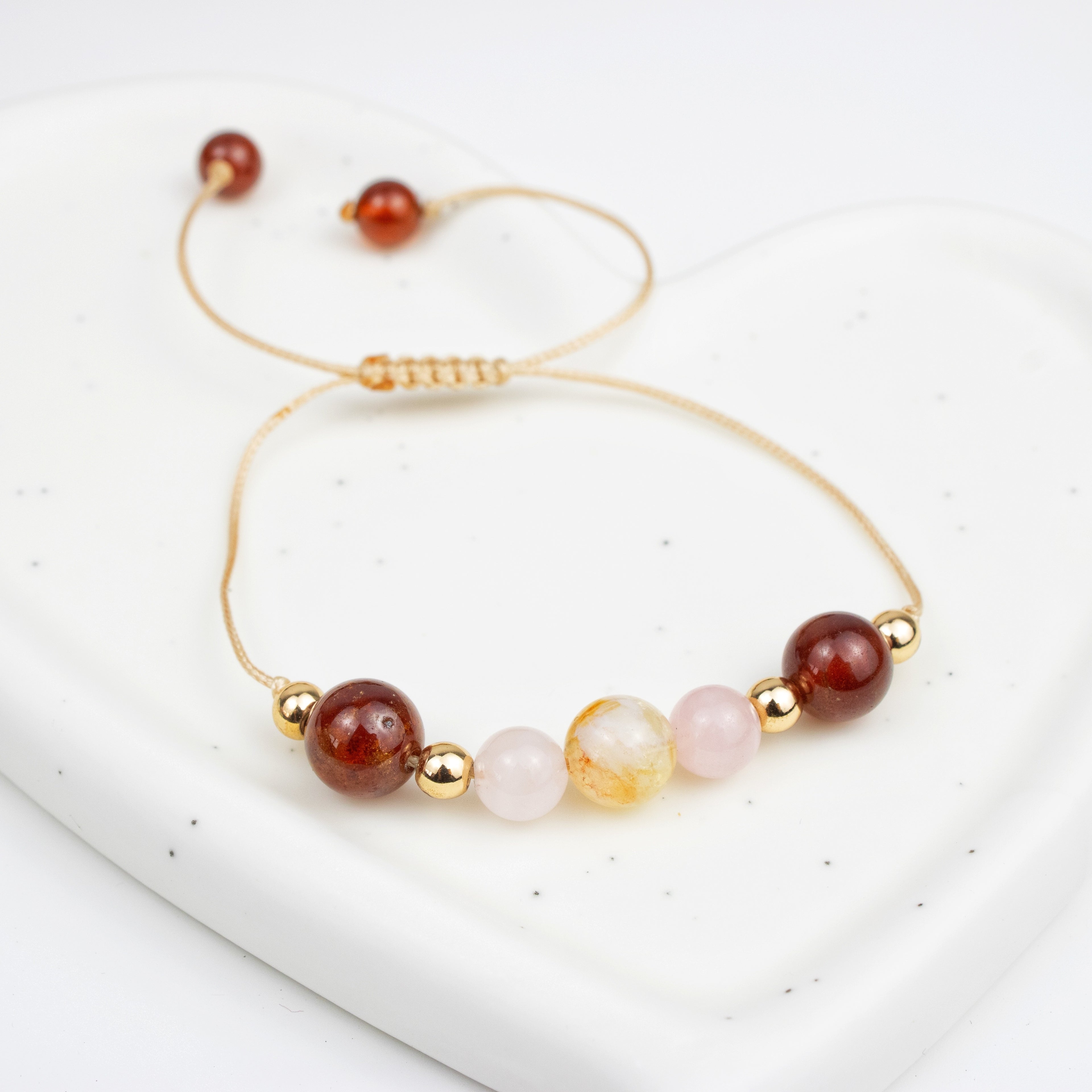 Bracelet made of Rose Quartz, Garnet, and Citrine stones