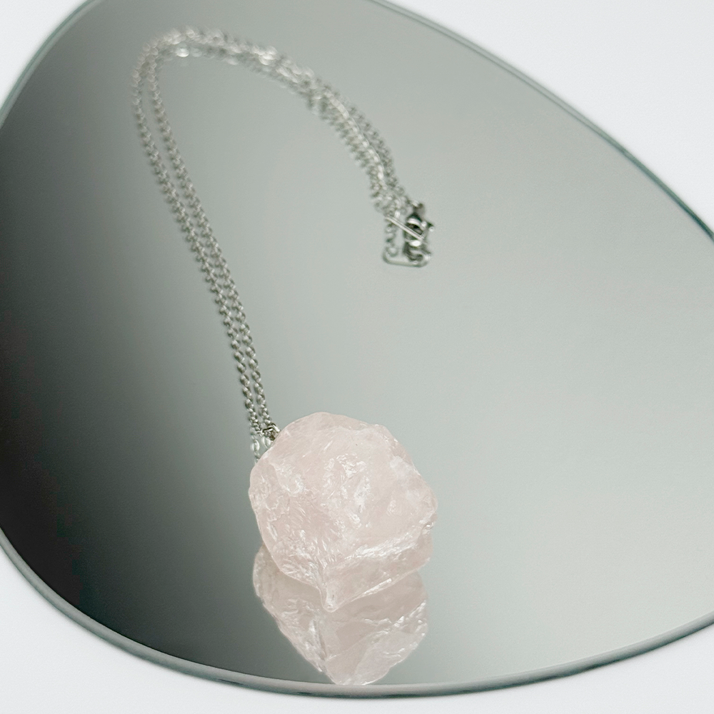 Raw Rose Quartz stone on a chain