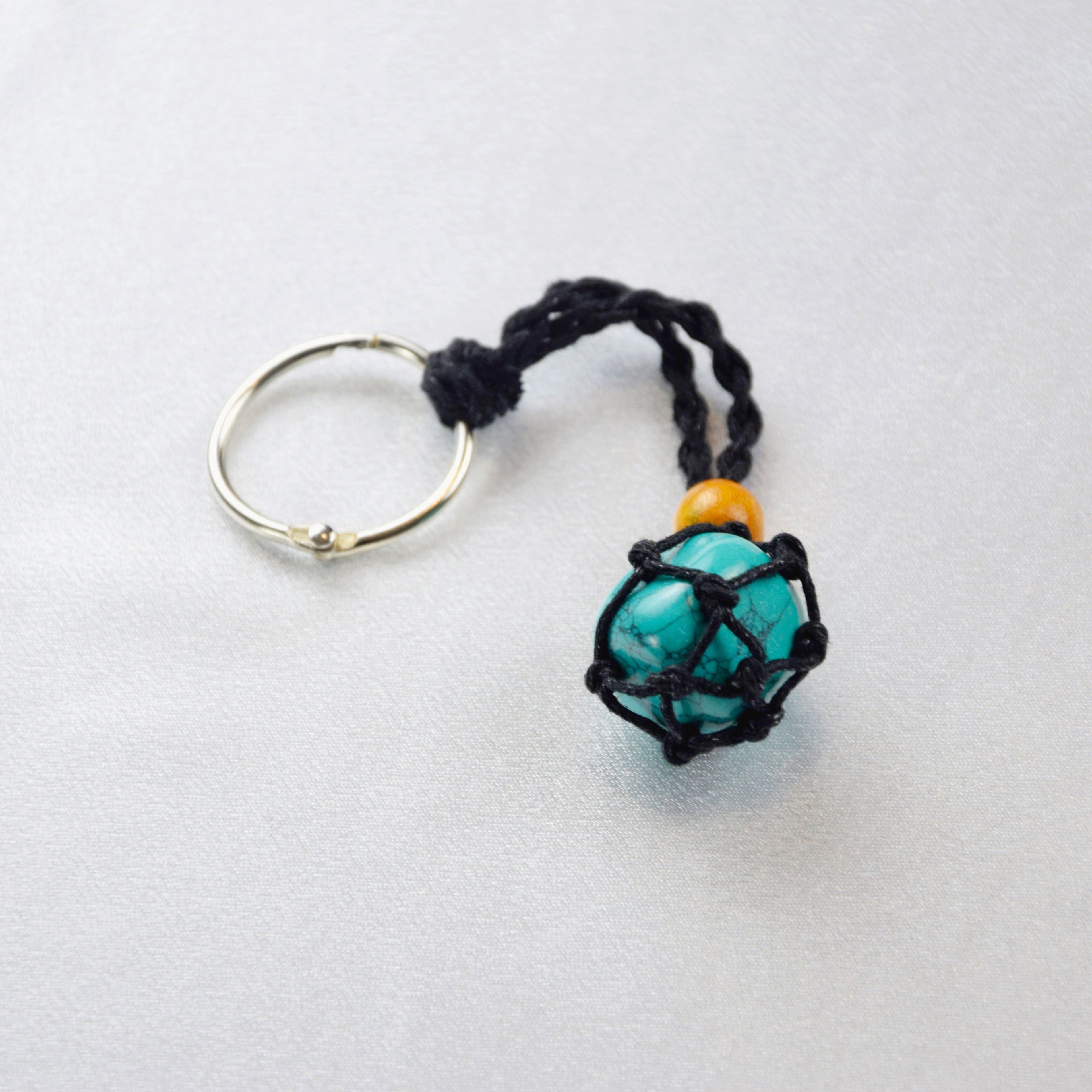 Keychain with a natural Turquoise stone on a cord