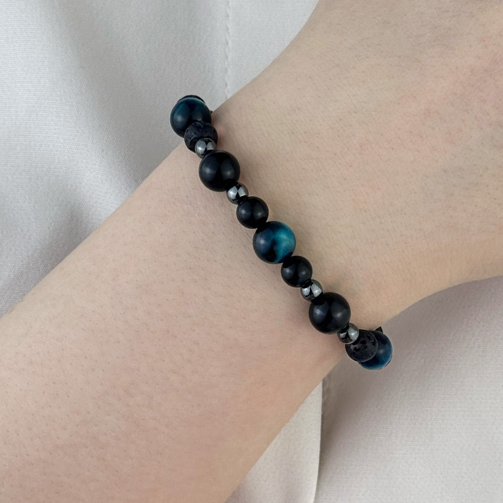 Bracelet made of natural Tourmaline, Lava Stone, and Tiger’s Eye stones on elastic thread