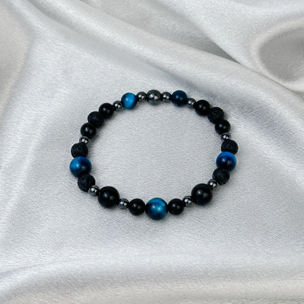Bracelet made of natural Tourmaline, Lava Stone, and Tiger’s Eye stones on elastic thread