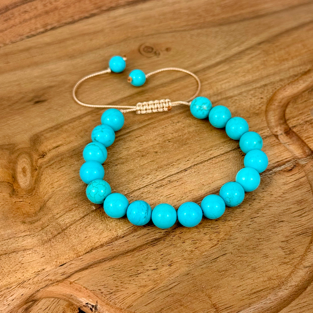 Turquoise beaded bracelet on a wooden surface